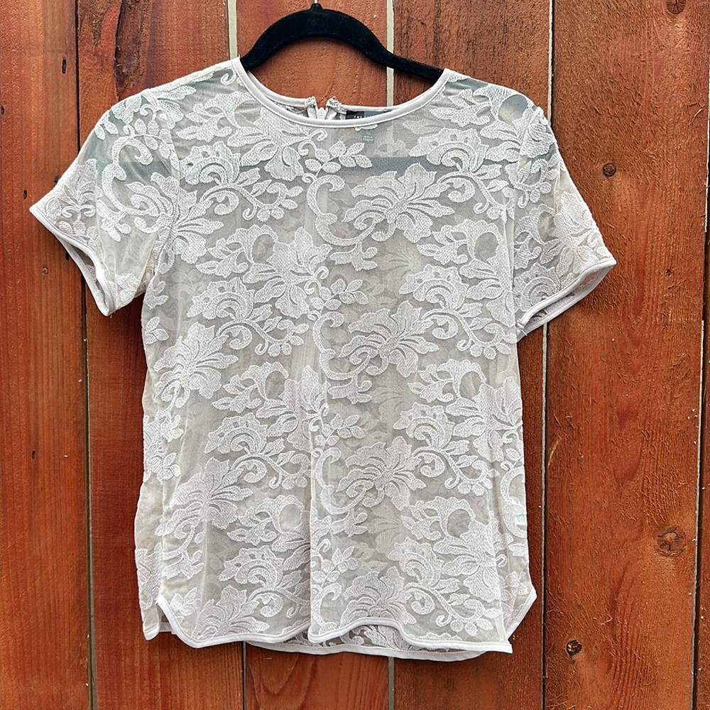 Limited. Sheer floral top. With back zipper, worn good condition. Petite xs.